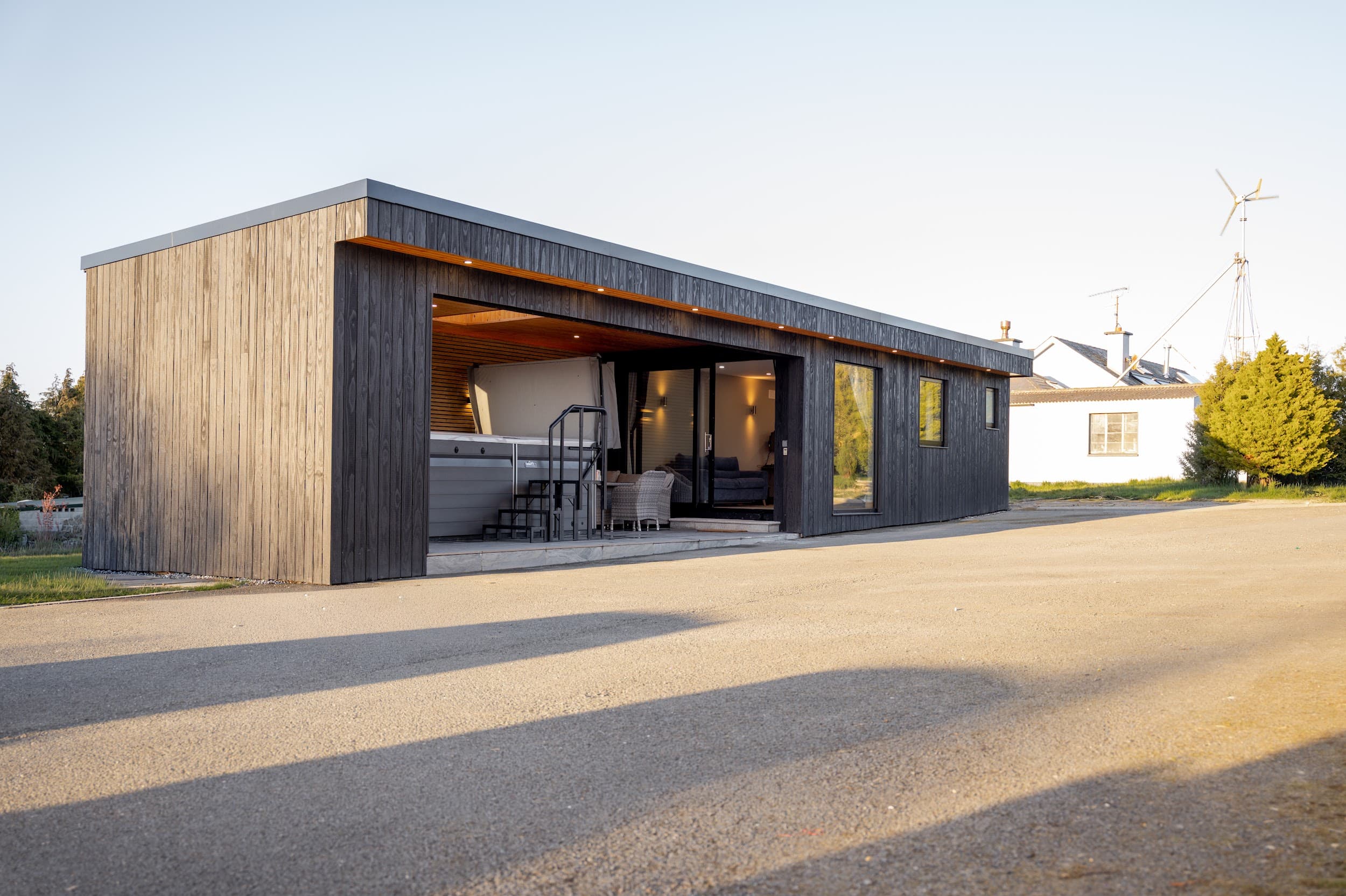 Exterior of a garden room showing cedar and charcoal timber cladding with aluminium trim