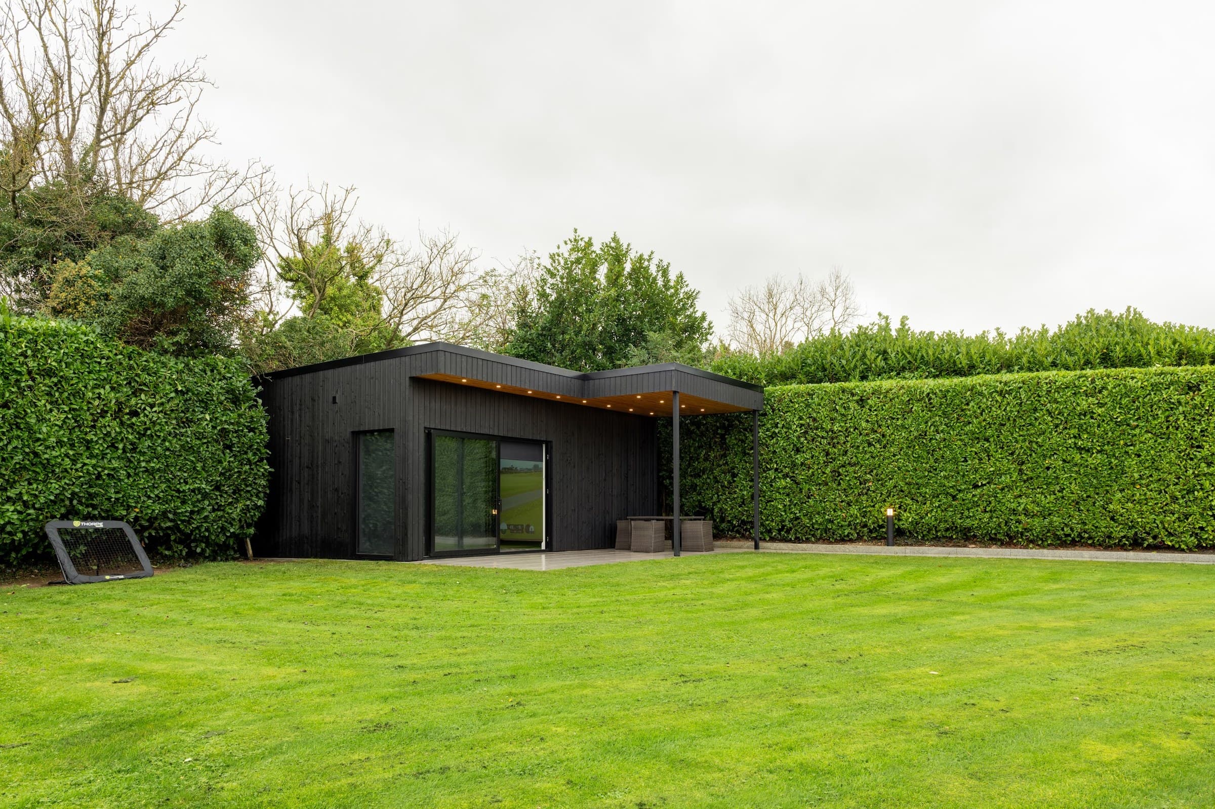 Insulated garden room built for a home golf simulator