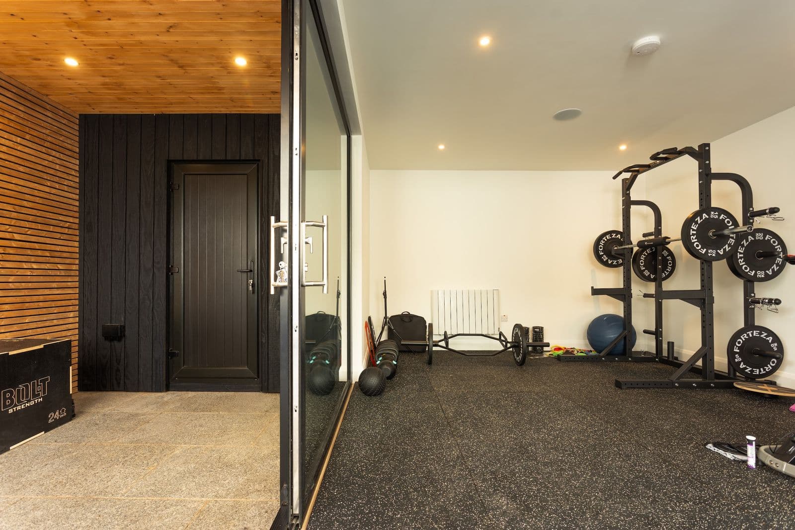 Insulated bespoke garden room interior in Clonskeagh fitted as a training gym